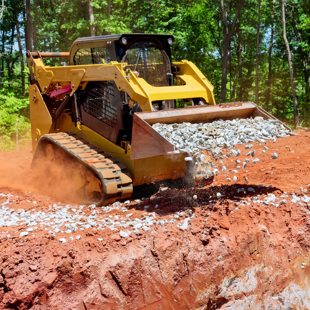 skid steer spreading rocks for excavating & land clearing Eustis FL